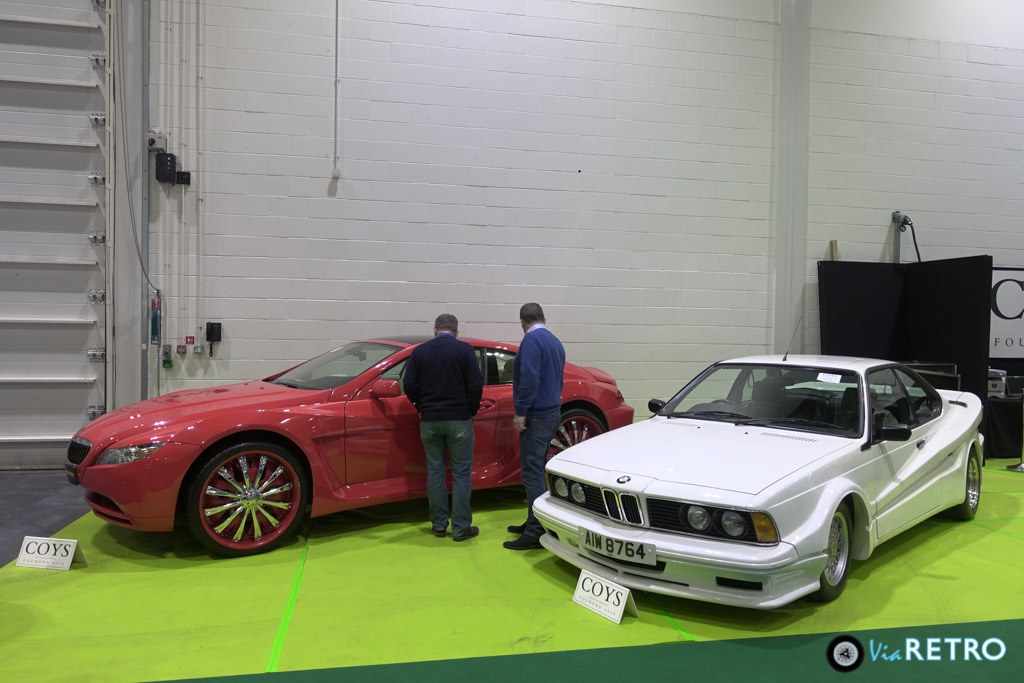 Den grimme König BMW bliver til en vis grad reddet af, at der står en endnu grimmere bil ved siden af: En tåbe havde sat 24-tommer hjul på noget BMW 645-teknik og opnået den effekt, at få det til at se ud som at at hjulene kommer med bilen og ikke omvendt.